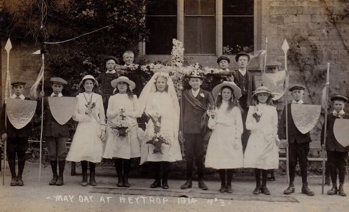 A May King and Queen at Heythrop, 1914. Note the cruciform garland and the four armed attendants - this was the eve of the Great War.
